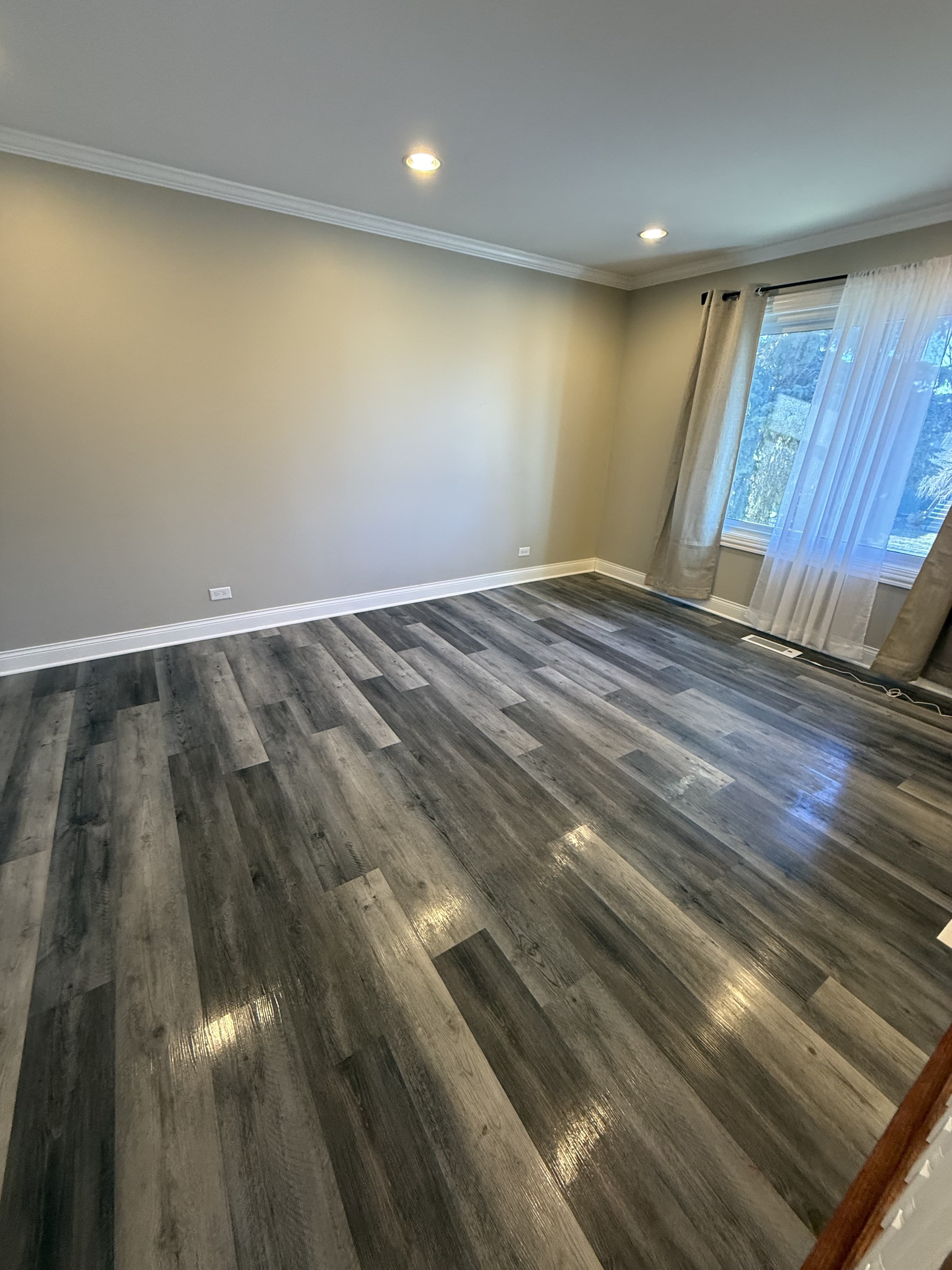 Clean living room with dark hardwood floors — recurring maid service in Plainfield IL